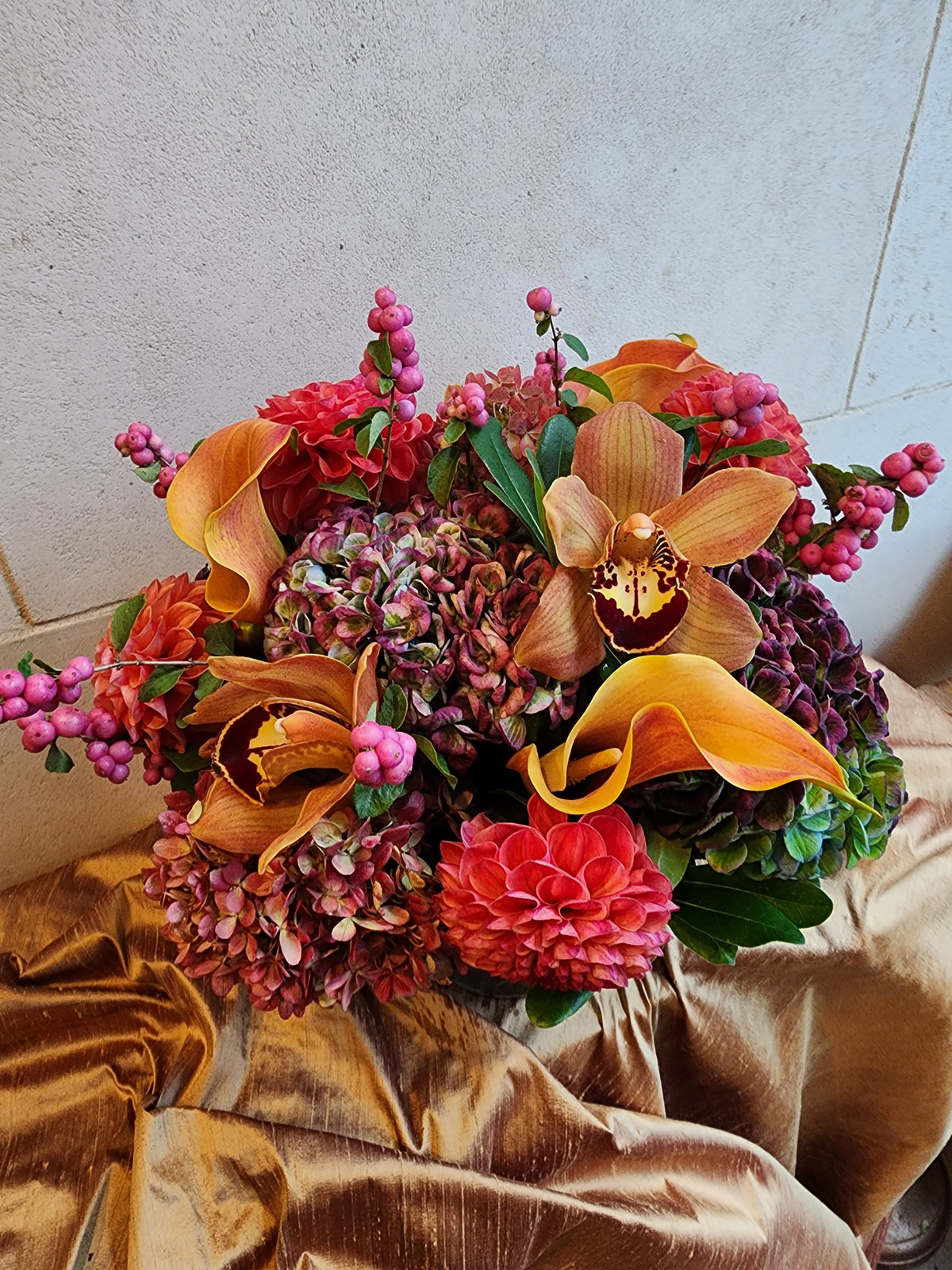 Custom floral arrangement created with a curated selection of fresh seasonal flowers and greenery.