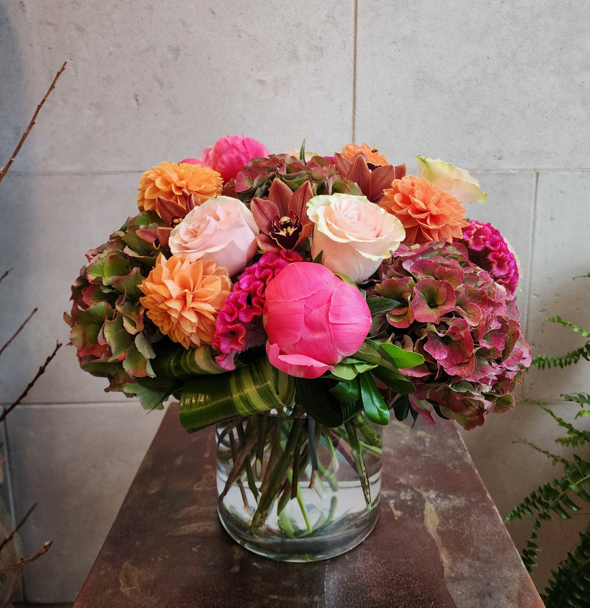 Custom floral arrangement created with a curated selection of fresh seasonal flowers and greenery.